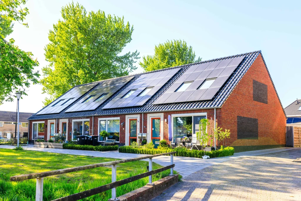 Modern two-story suburban home with rooftop solar panels, requiring updated homeowners insurance coverage.