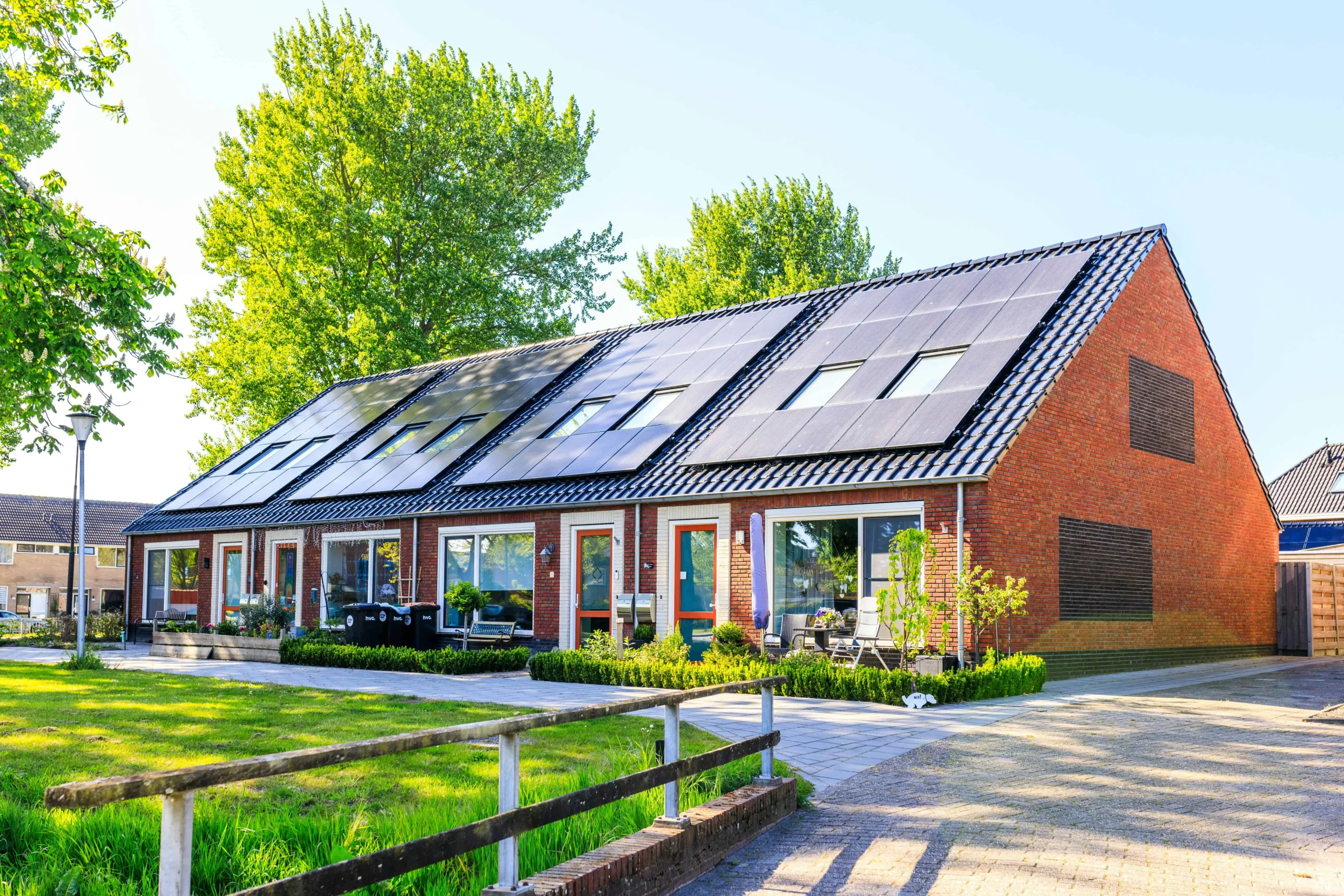 Modern two-story suburban home with rooftop solar panels, requiring updated homeowners insurance coverage.